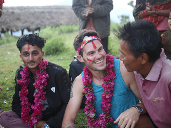 MDP student sitting with his collaborators in Nepal, summer 2019