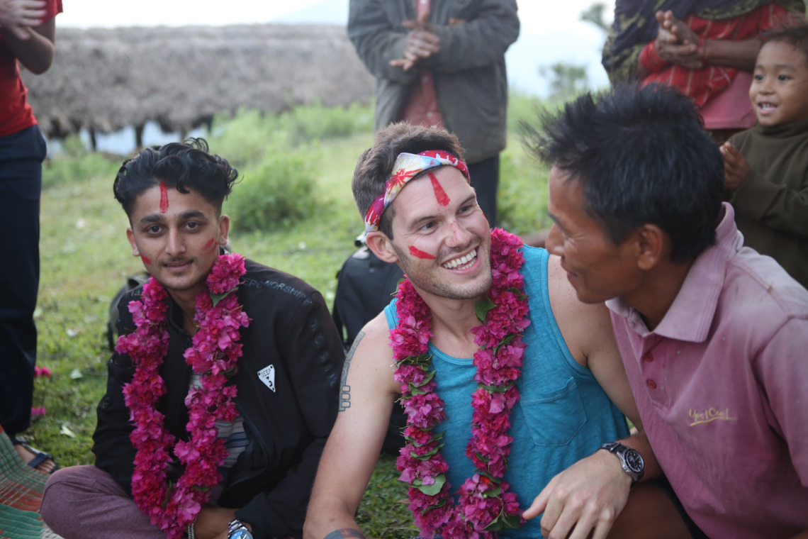 MDP student sitting with his collaborators in Nepal, summer 2019
