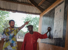 Jake, at left, leading a session on malaria prevention